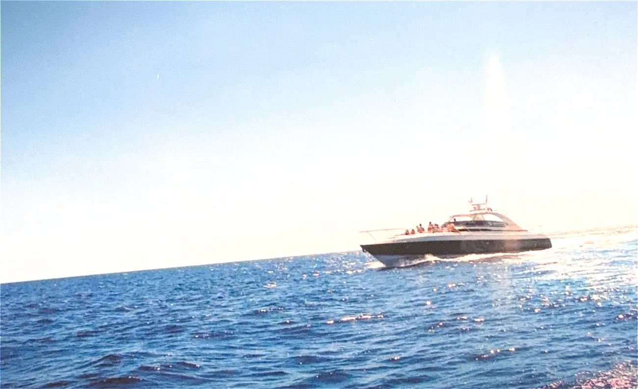 A motor yacht underway offshore on open water
