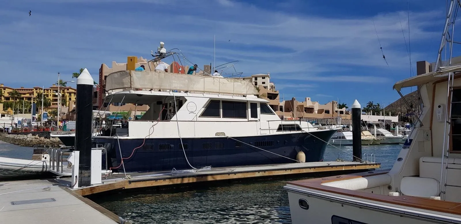 Angeli after her refit, with a blue hull, alongside at a marina in Los Cabos