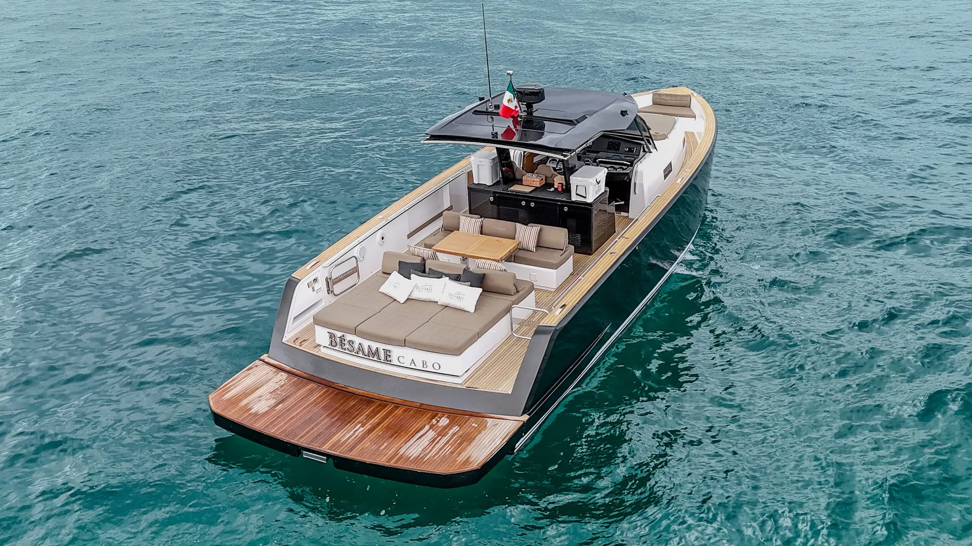Aerial stern view of Bésame showing teak swim platform and sunpads