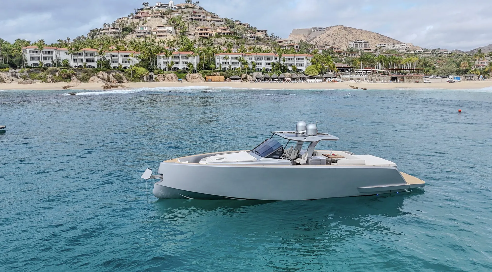 Side profile of CIAO anchored off Palmilla beach in Los Cabos