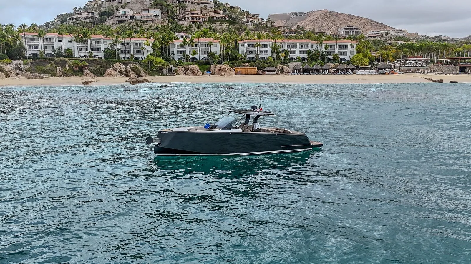 Bésame at anchor in front of a Los Cabos beach resort