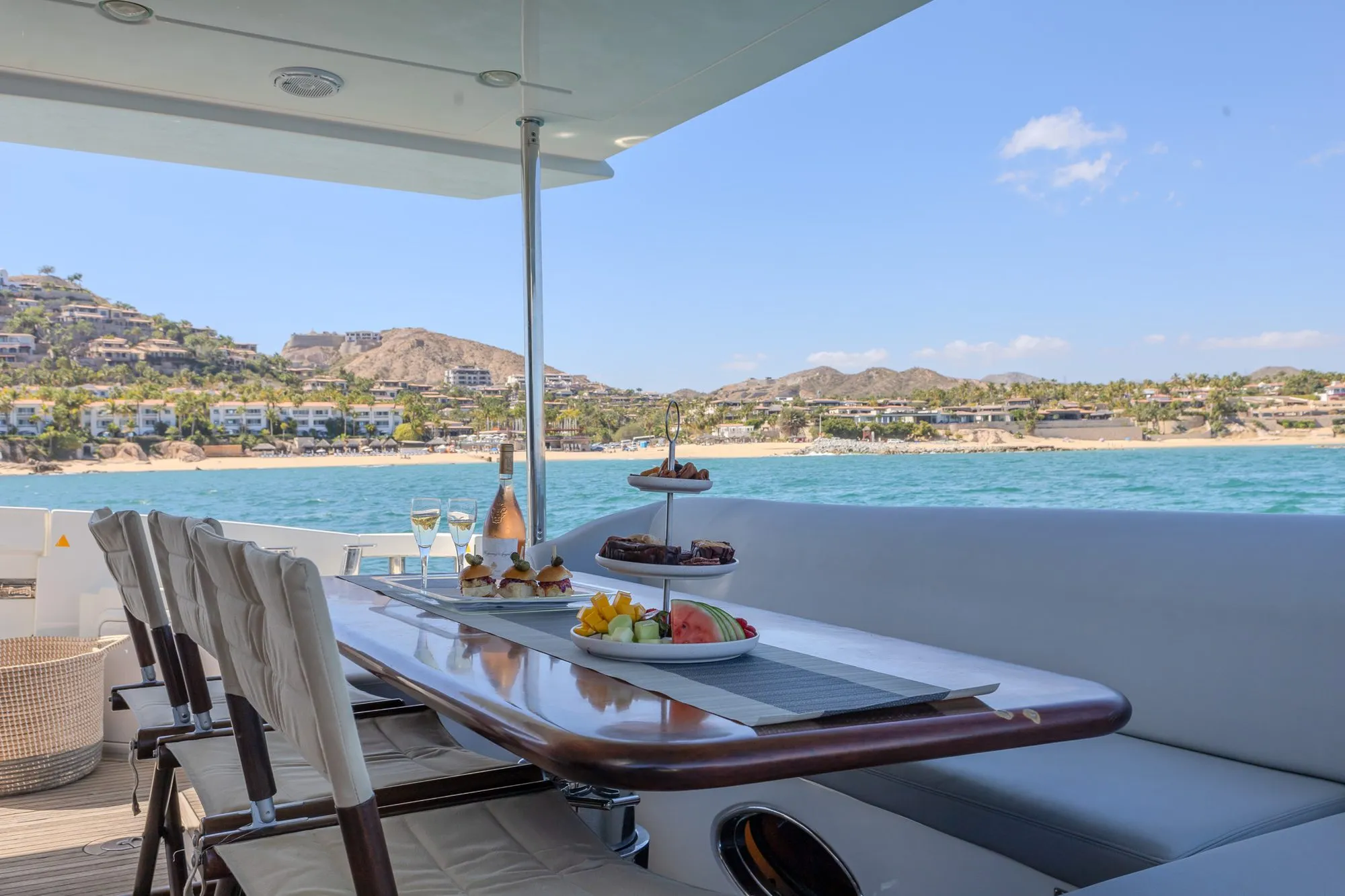 Lunch served on the aft deck table of Cardinale facing the beach