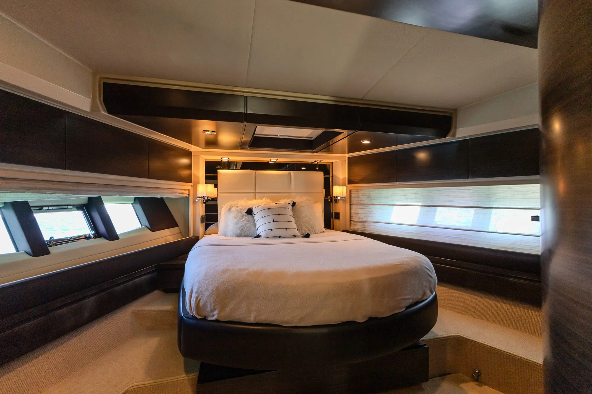 Master cabin of Cardinale with double bed and hull windows