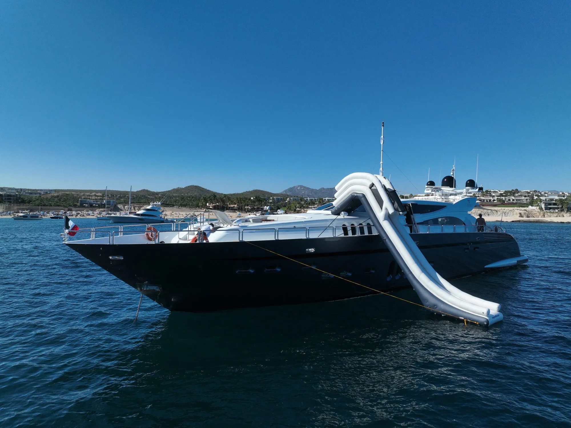 GO at anchor with inflatable waterslide deployed from the upper deck