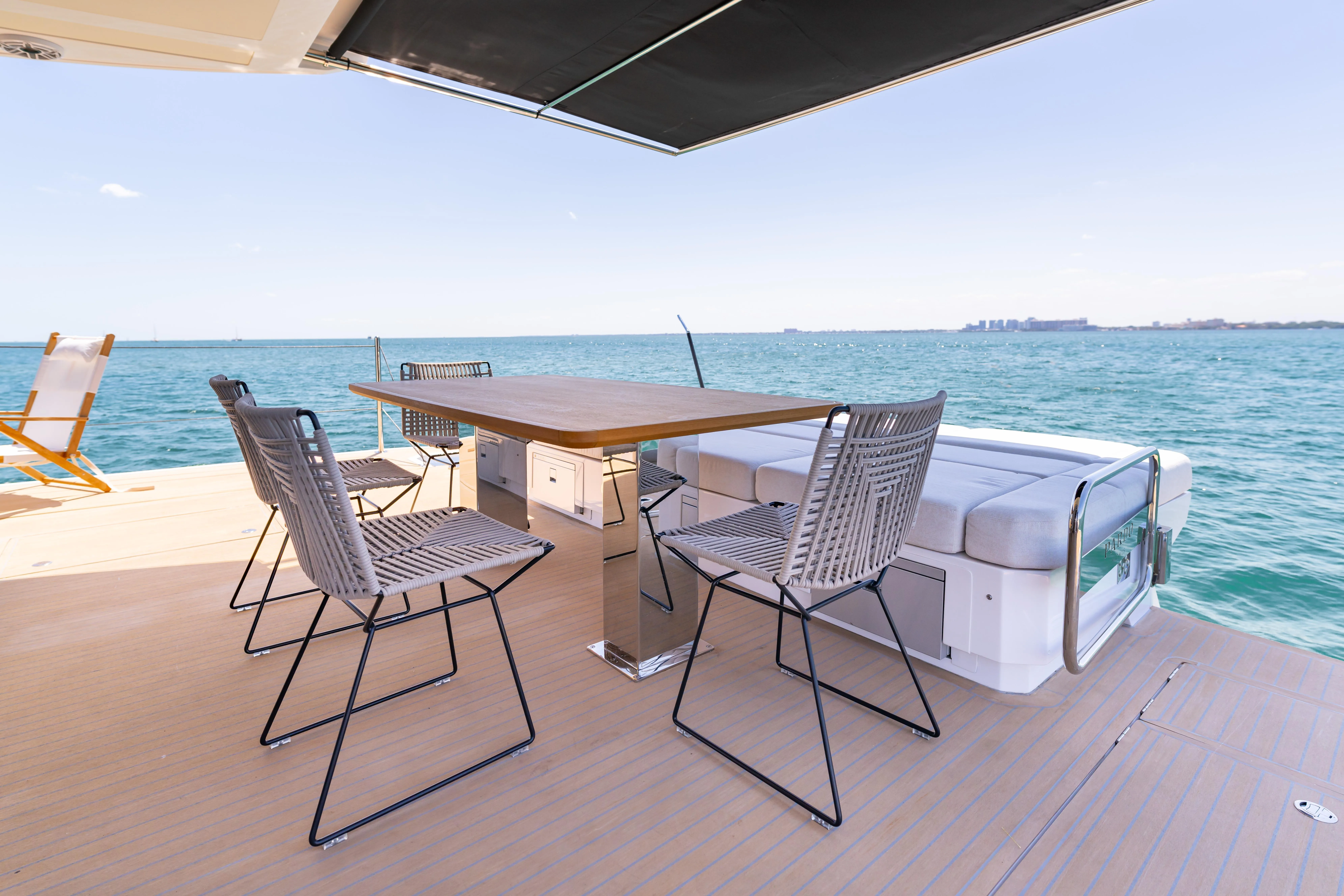 Flybridge deck with dining table aboard the Pardo E72