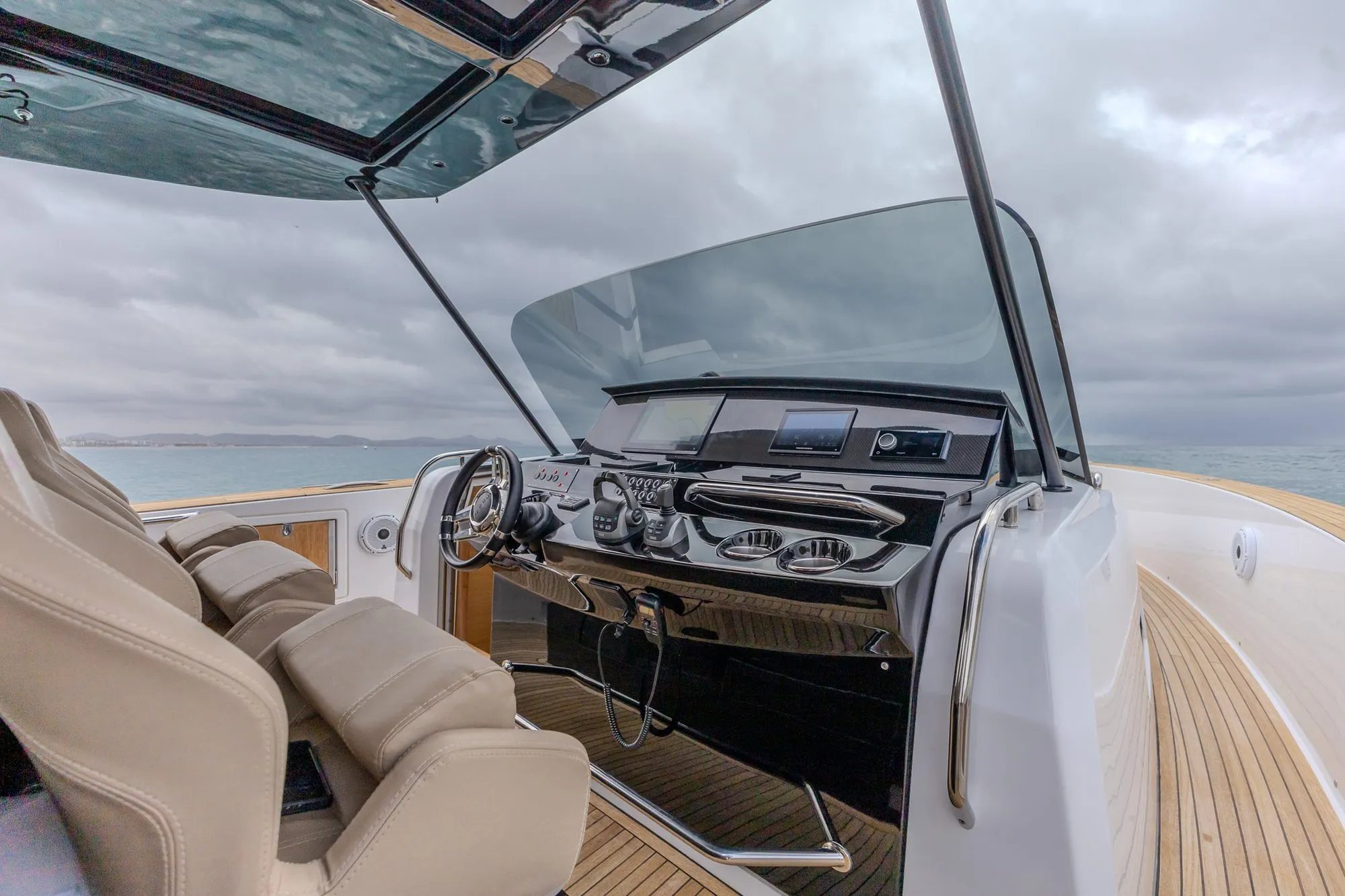 Helm station of Bésame with twin displays and teak decking