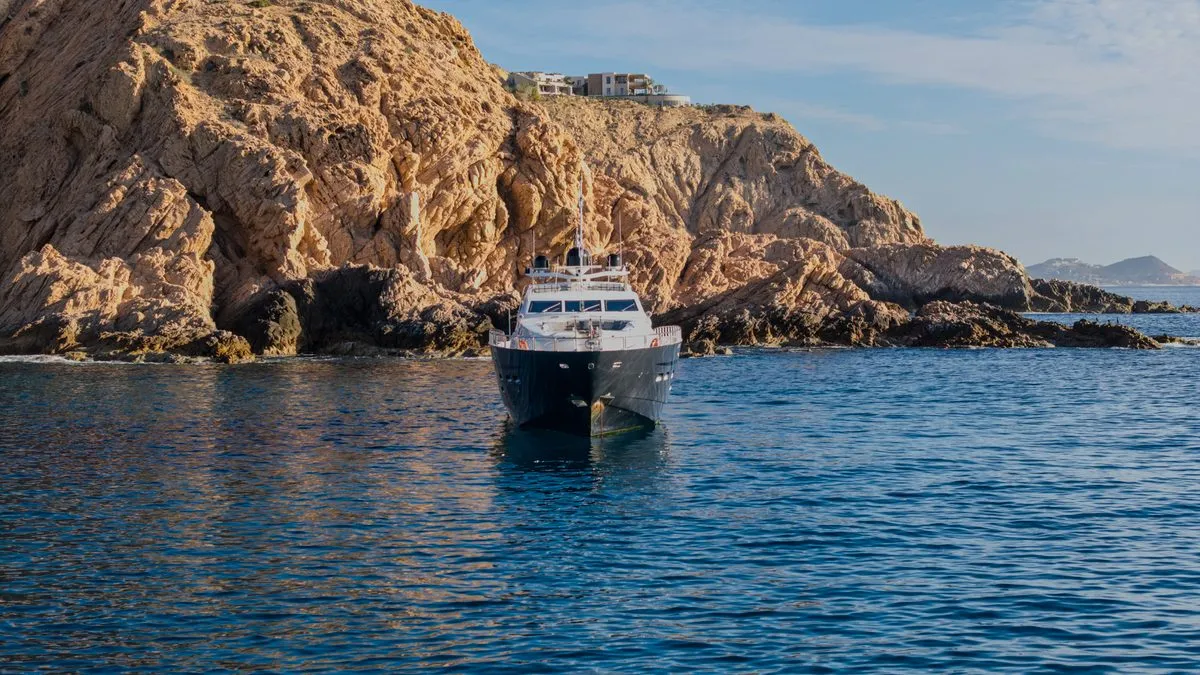 Bow view of GO at anchor beneath the cliffs near Santa Maria Bay