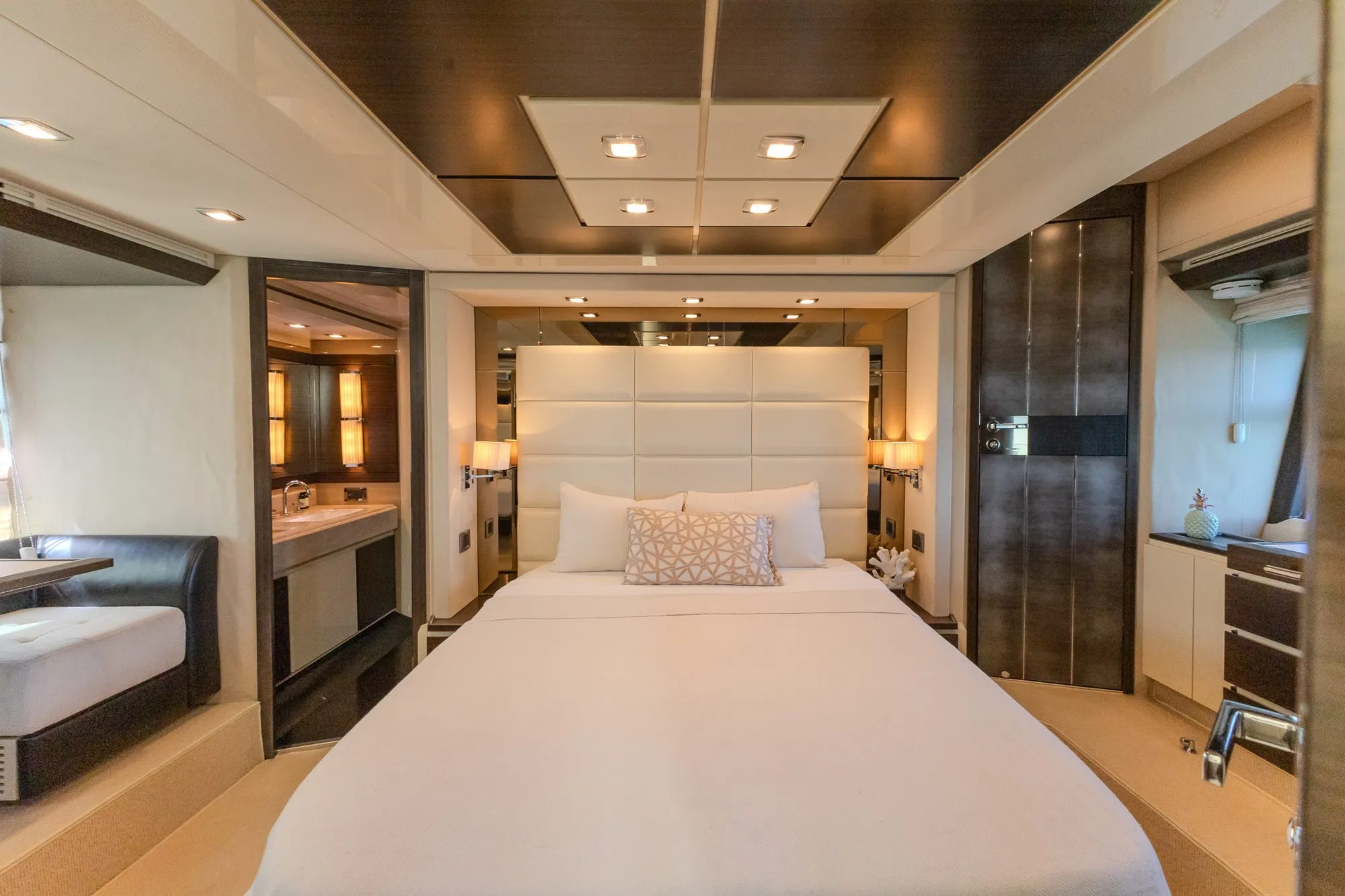 VIP stateroom on Cardinale with padded headboard and ensuite bathroom beyond