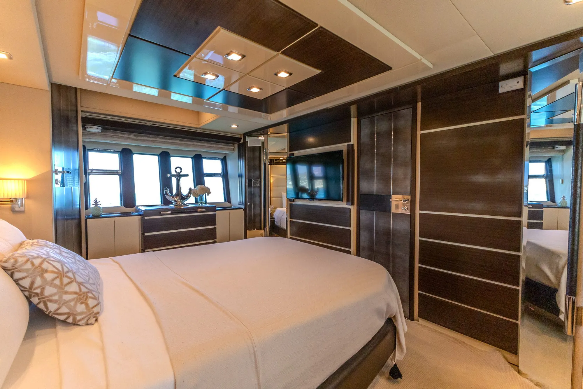 Full beam master stateroom of Cardinale with dresser, TV and wardrobes