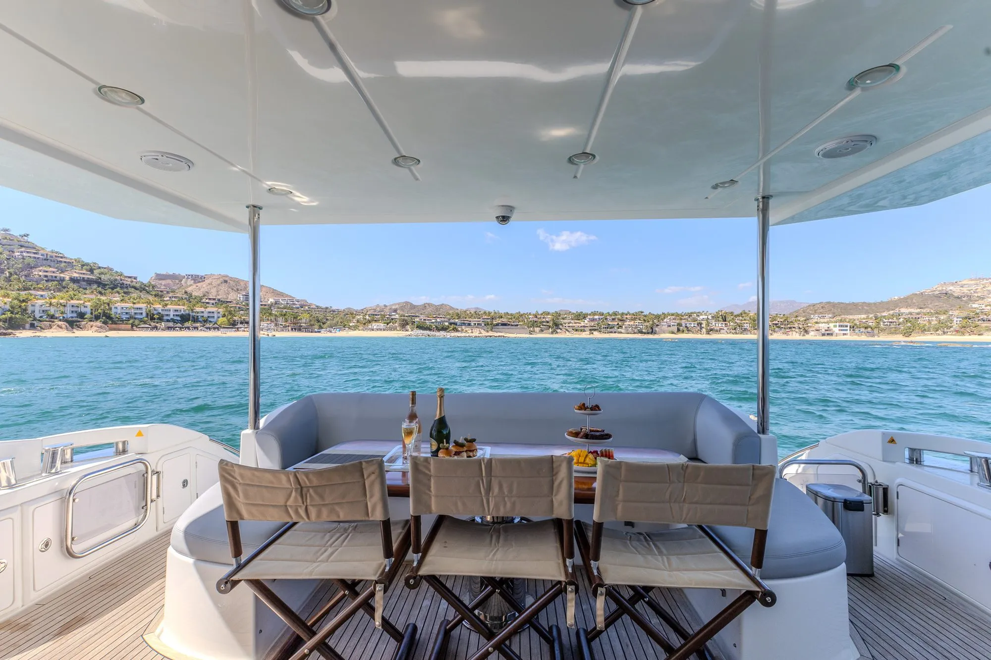 Alfresco lunch with champagne set on Cardinale aft deck off Palmilla