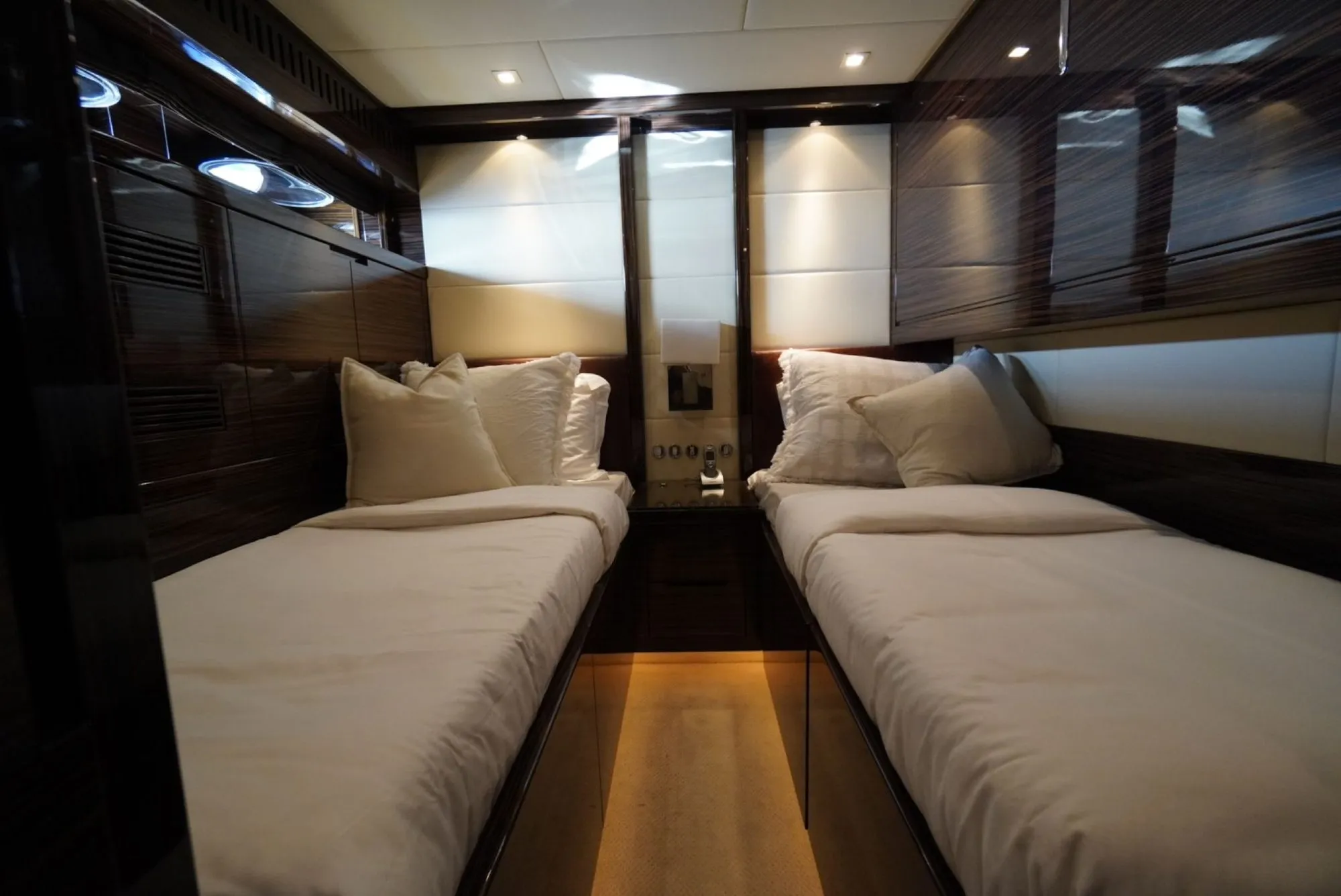 Twin guest cabin aboard GO with ebony joinery and mood lighting