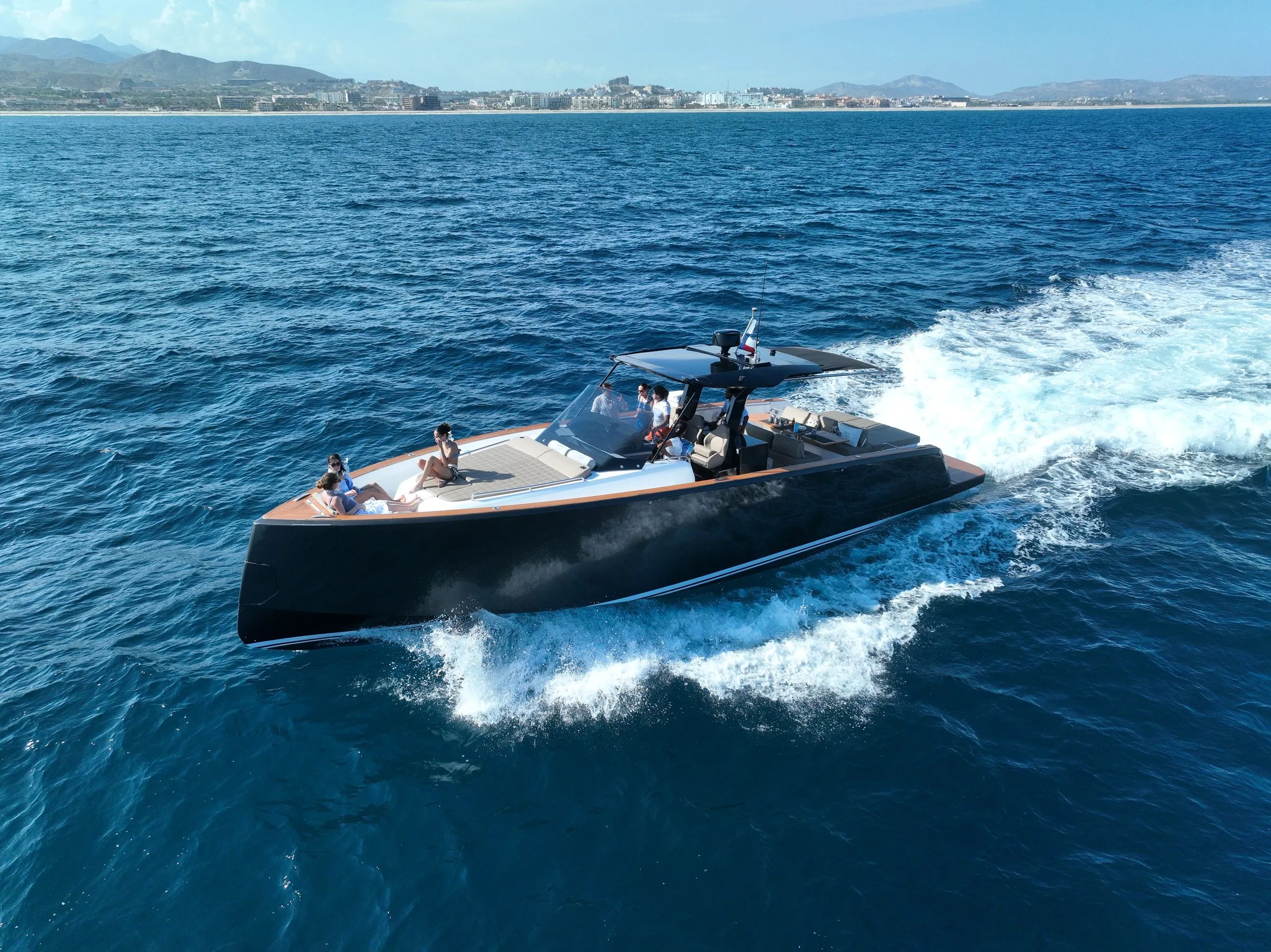 Bésame running at speed off the Los Cabos coast, aerial view