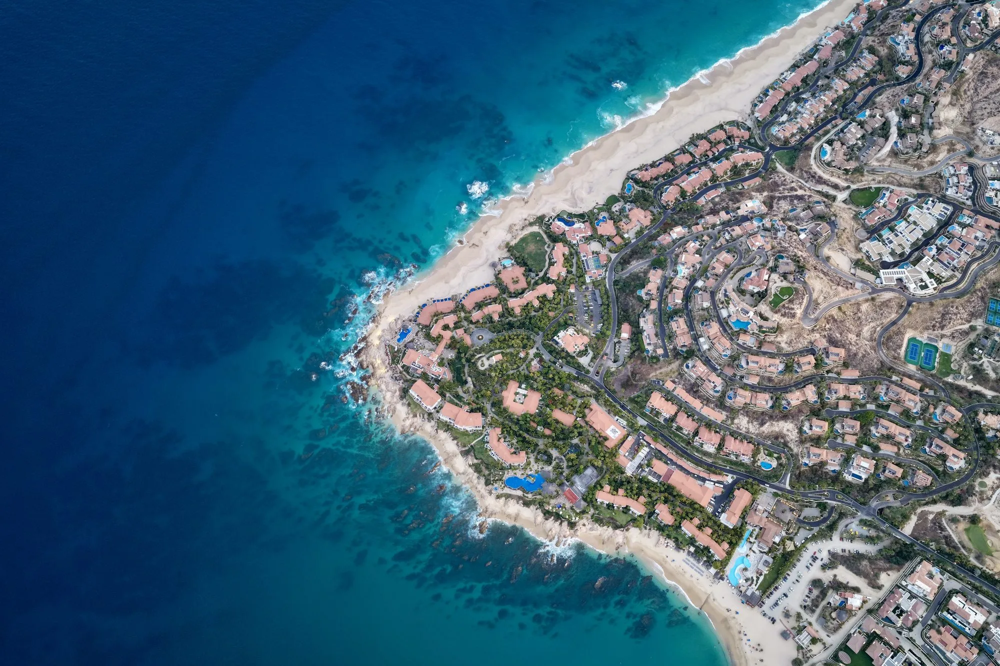 Top down aerial of Punta Palmilla with turquoise coves and beaches