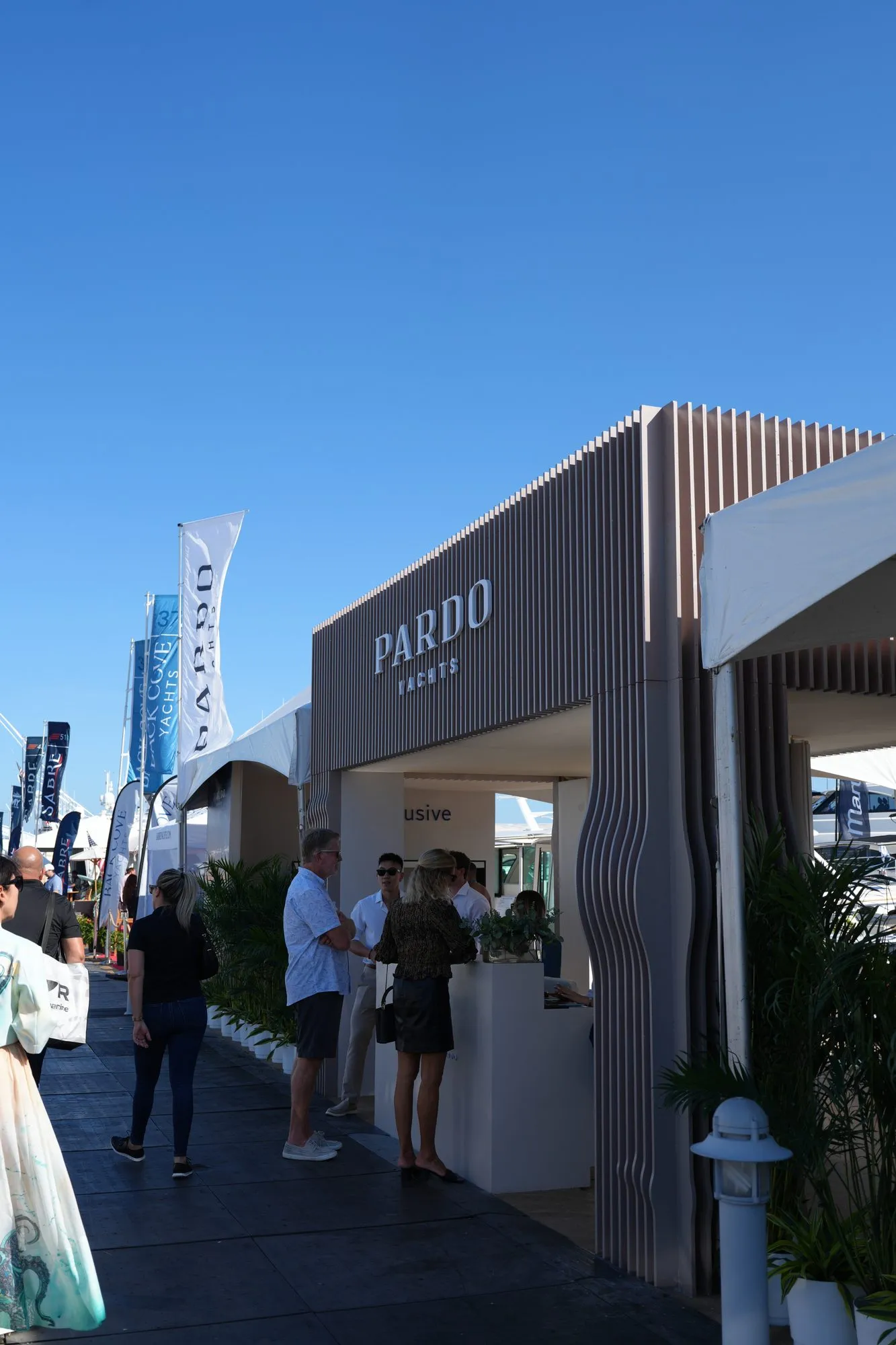 Visitors at the Pardo Yachts stand during a boat show