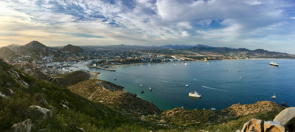 Medano Bay in Los Cabos with yacht on the water.