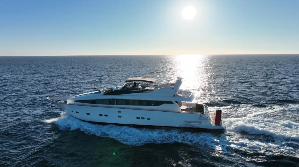 Picture of the Avante yacht on the water as the sun is going down.