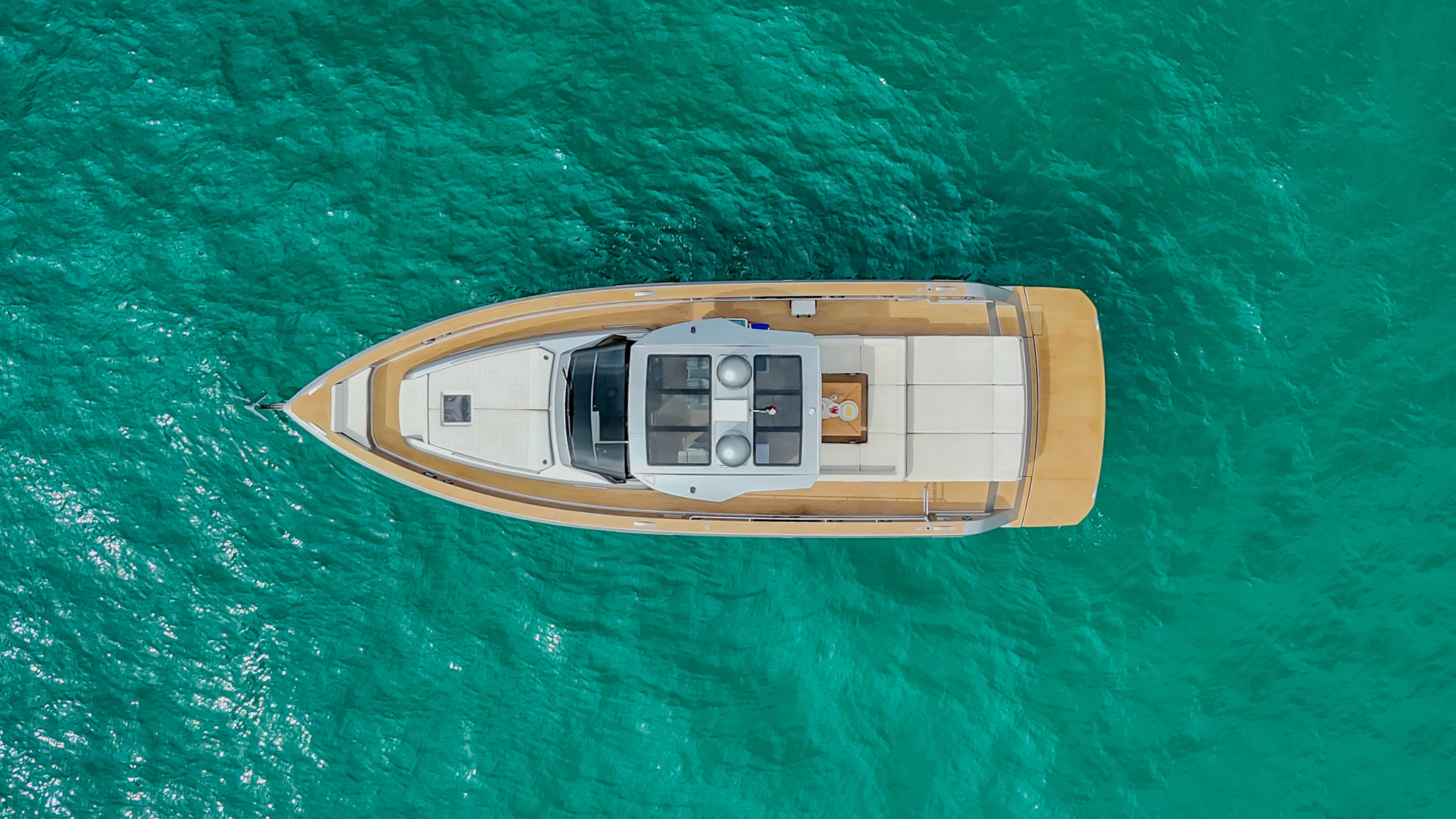 Birds eye view of CIAO Yacht in middle of ocean.