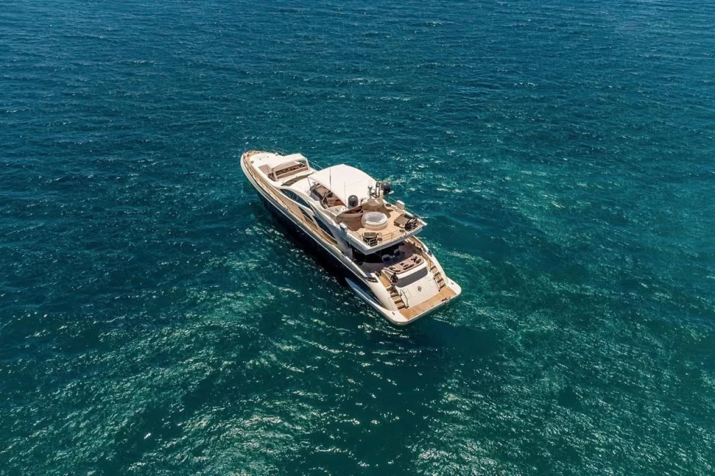 Otaduy's Ganesha yacht is available for charter, standing on turquoise water.
