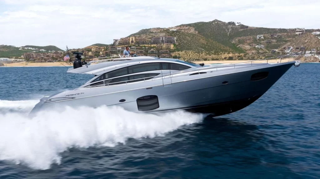 Otaduy's Pershing 74 yacht available for charter cruising through the water.