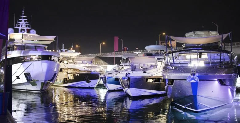 Miami's harbour with yachts for the Miami Boat Show at night.