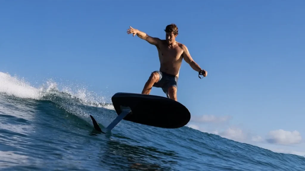 A man on a Fliteboard riding a wave.