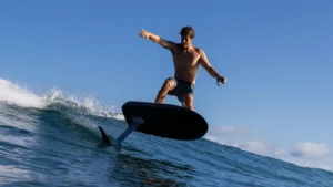 A man on a Fliteboard riding a wave.