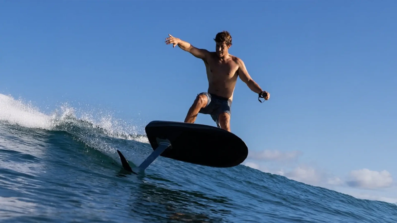 A man on a Fliteboard riding a wave.