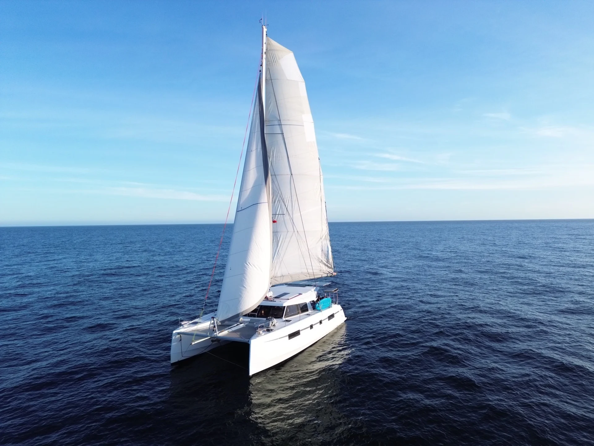 The sailing catamaran Telemachus on a bright and clear day.