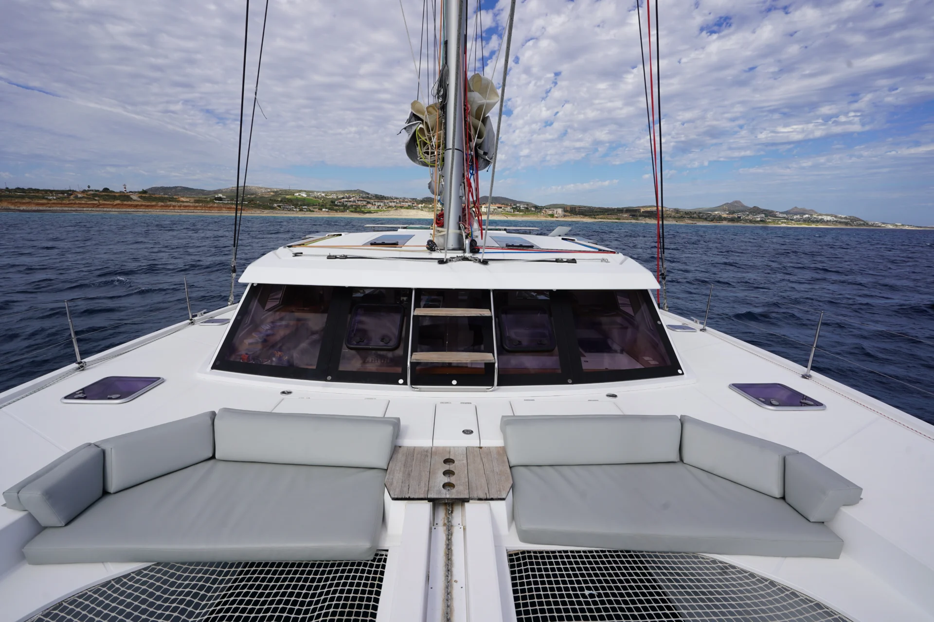 Two grey seating on the sailing catamaran Telemachus.