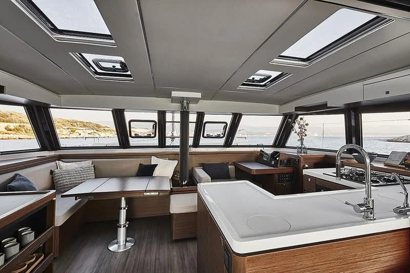 The interior salon and kitchen of the catamaran Telemachus.
